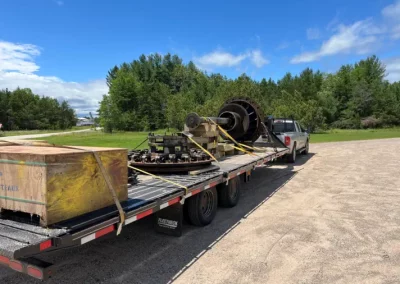 on-site pick up with turbine shaft and other parts on a long trailer